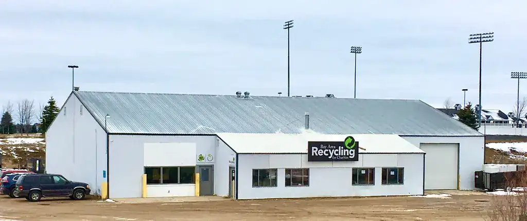 The Traverse City facility at 466 US-31 South, a long white building with stadium lights behind
